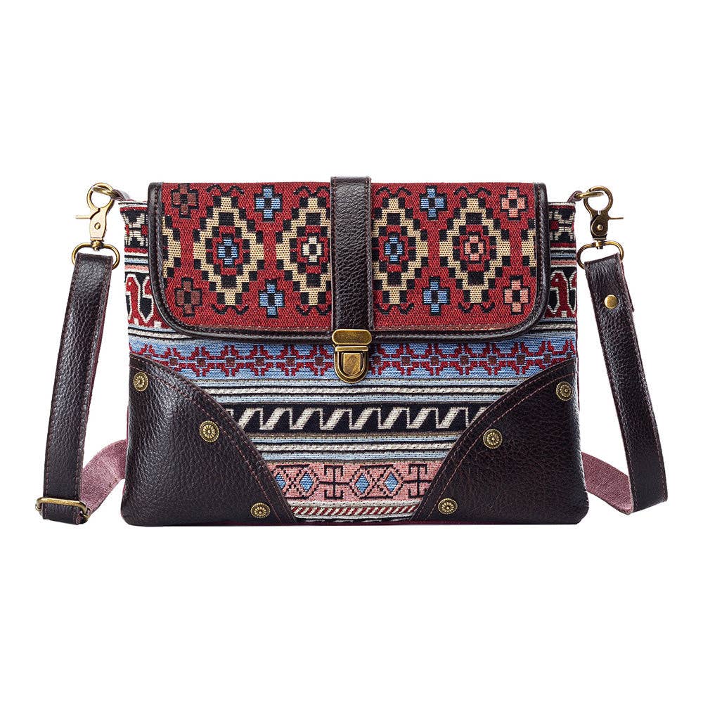 Multicolored patterned handbag with a strap on a white background