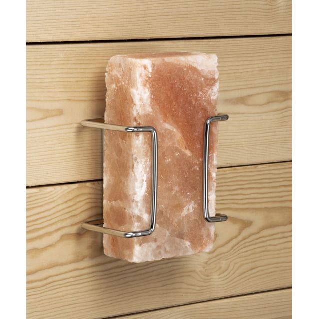 Salt block holder on a wall with a block of salt