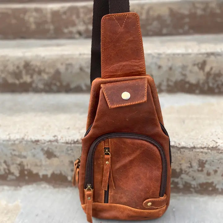 Brown leather crossbody sling bag with front pocket