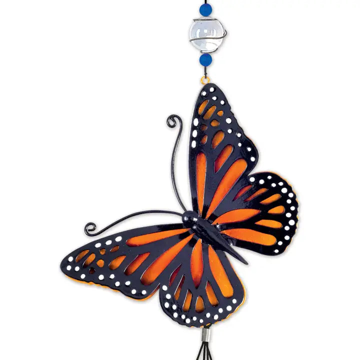 Butterfly-shaped 3D ornament with orange and black wings that tops the windchime