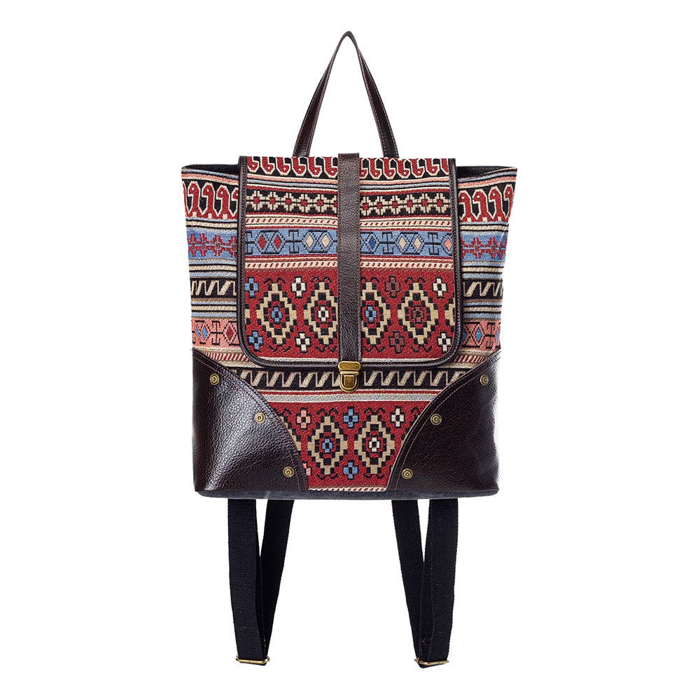 Backpack with aztec western design with a whitebackground.