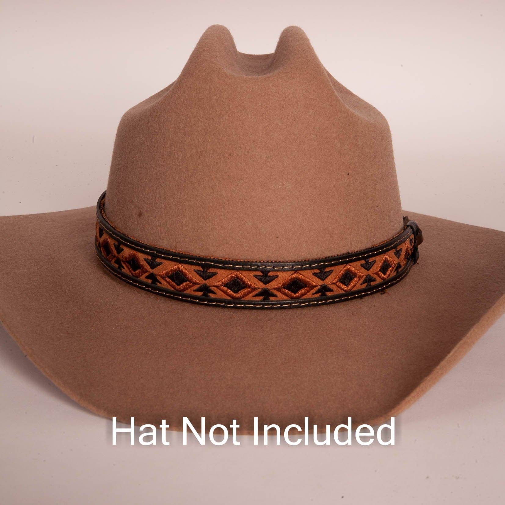 Brown cowboy hat with a decorative band on a beige background, with text 'Hat Not Included'.