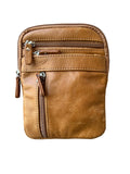 Brown leather crossbody bag with zippers on a white background