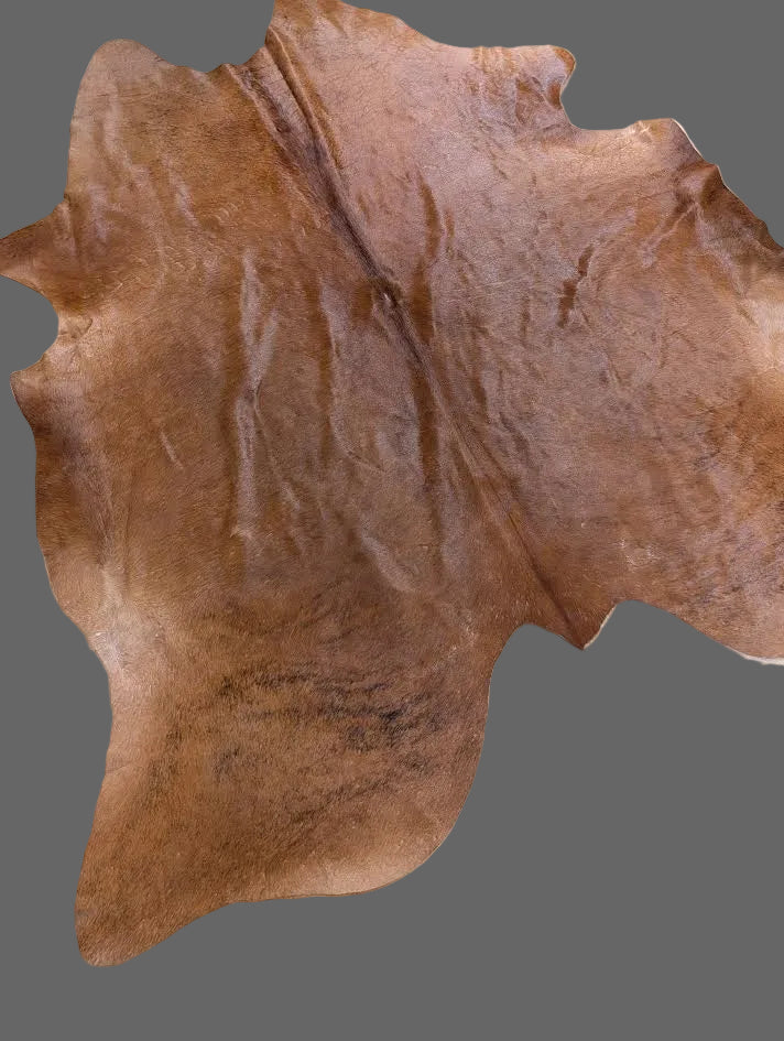 Reddish/brown cowhide rug