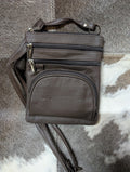 Dark Brown leather crossbody bag on a textured surface