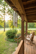 Wind chime hanging on cabin porch