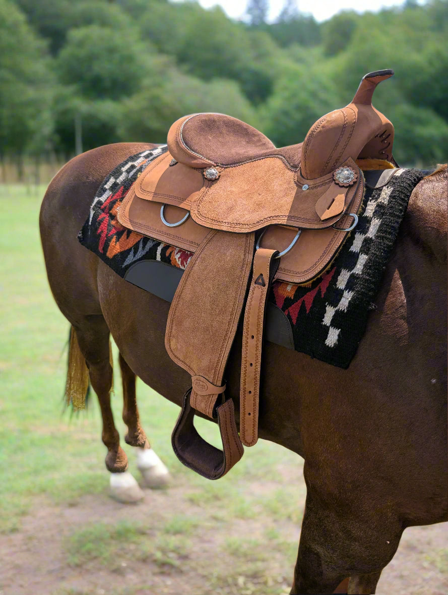 Durable roughout saddle with suede seat for secure all-day riding comfort
