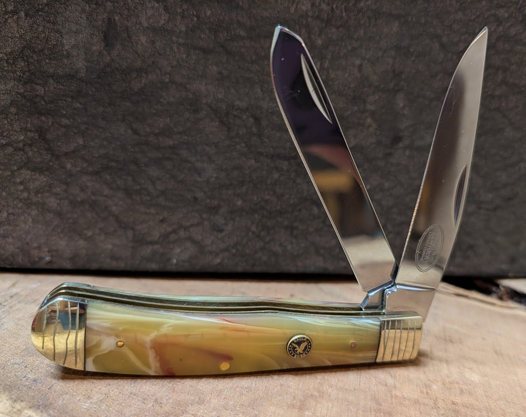 2 blade decorative knife with a light yellow pearl handle