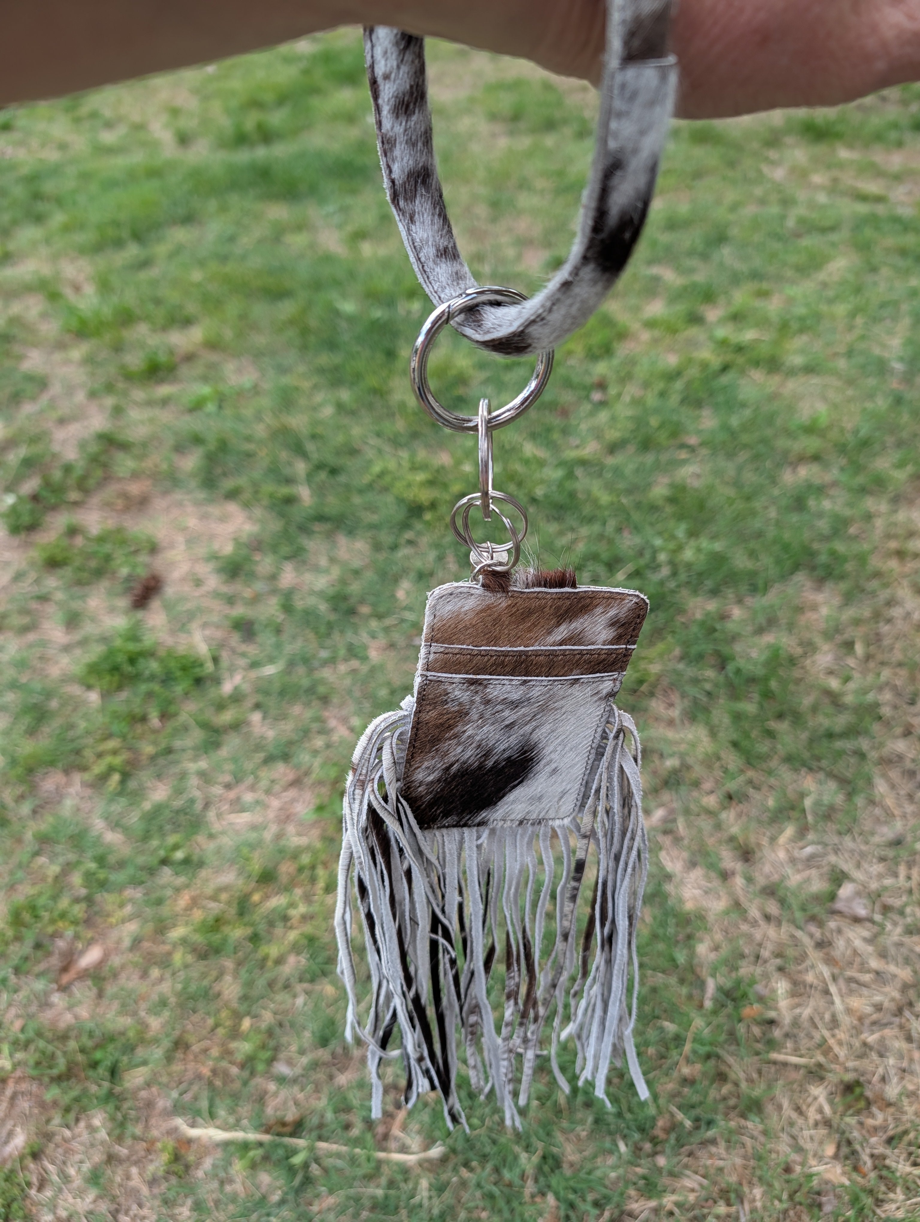 Bangle Wristlet that is made of genuine cowhide with a card holder