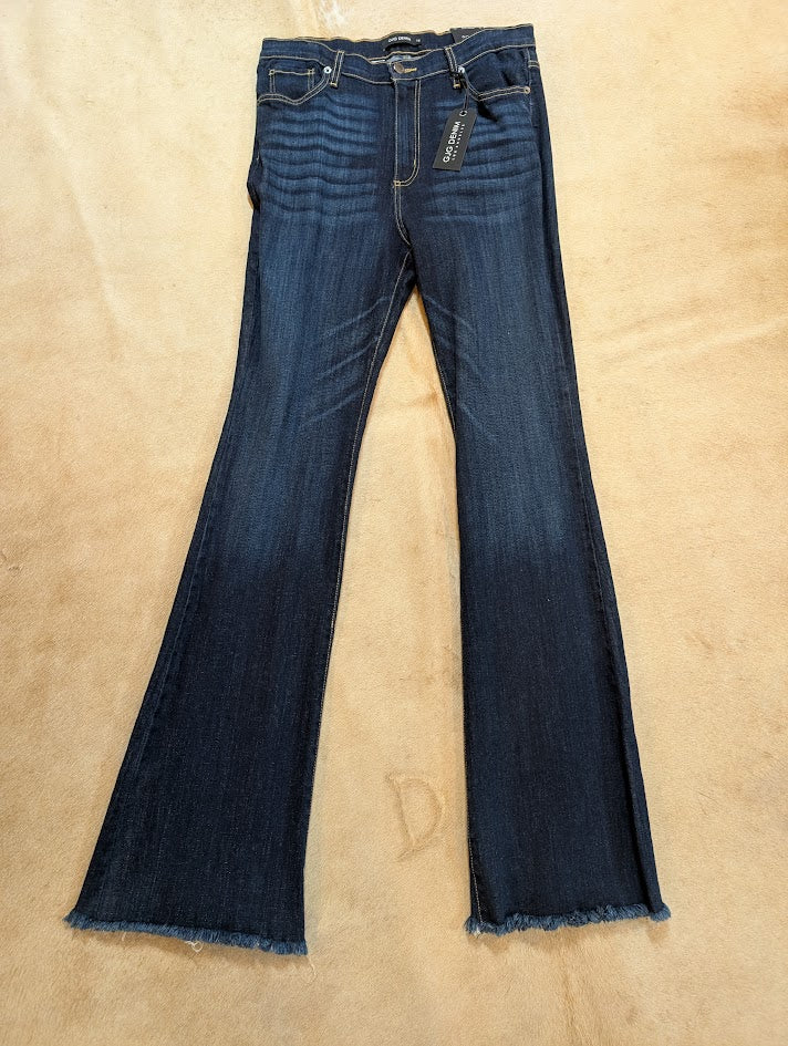 Pair of blue jeans on a beige background