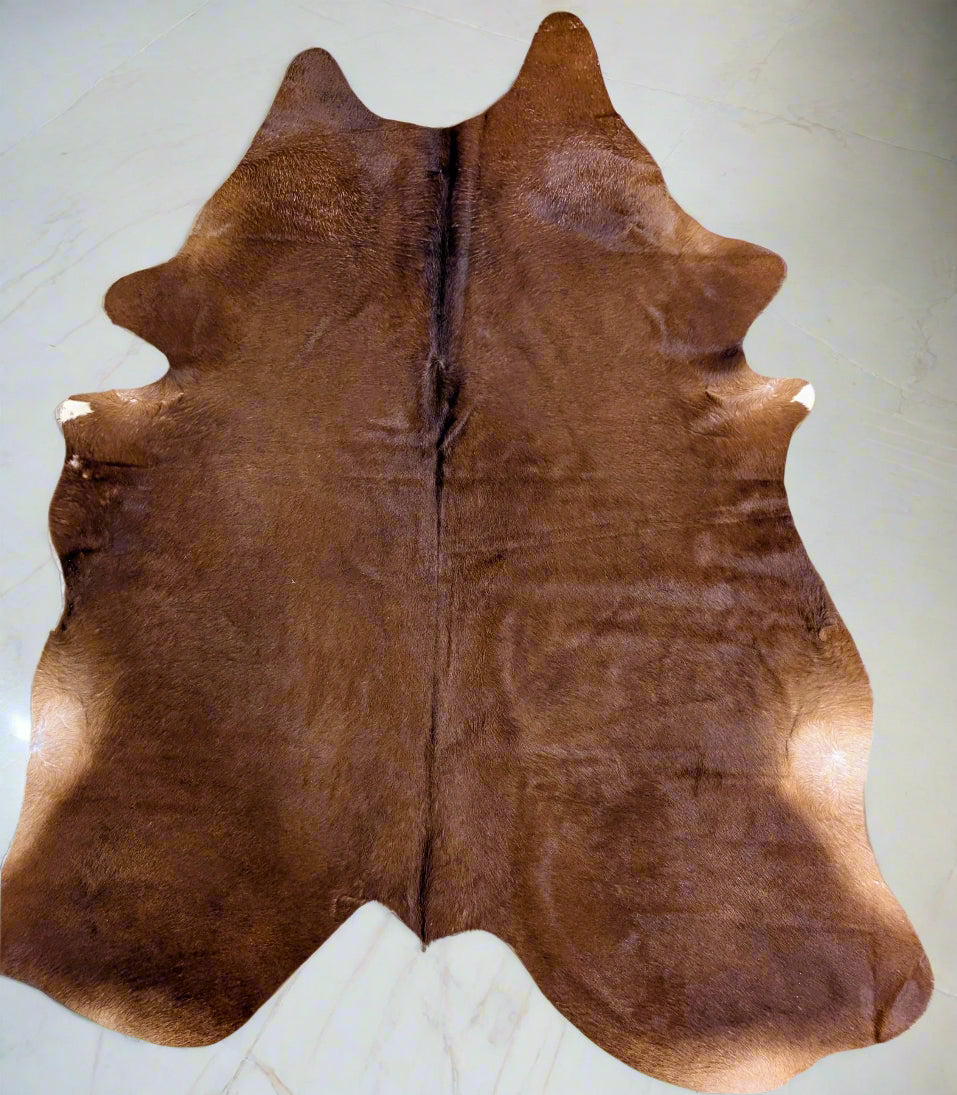 Hand-selected red cowhide with unique natural markings