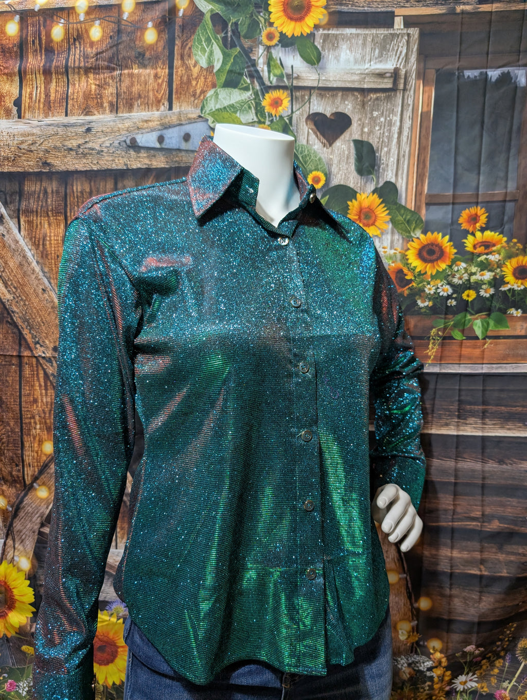 Close-up of glitter detail and stretch fabric on vibrant kelly green show shirt.