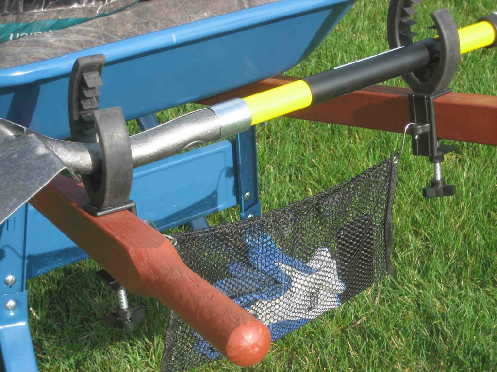 Grizzly Grip tool holder secures rakes, shovels, and hand tools to a wheelbarrow