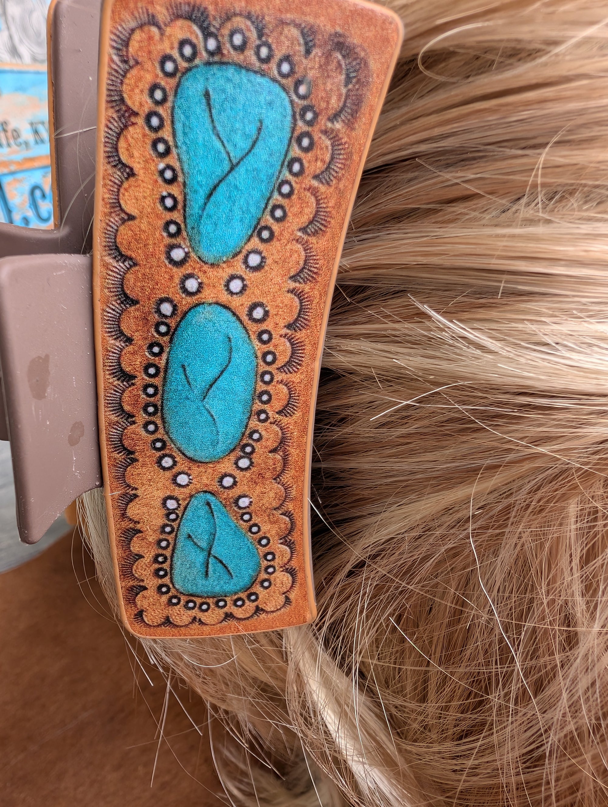 Turquoise-accented hair claw clip in bold cowgirl style