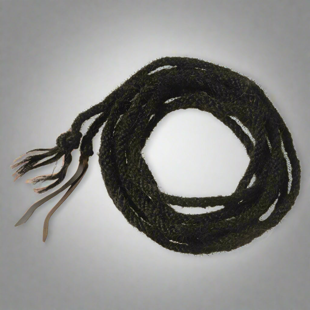 “Close-up of 4-plait black horsehair mecate rope with traditional Western texture”

