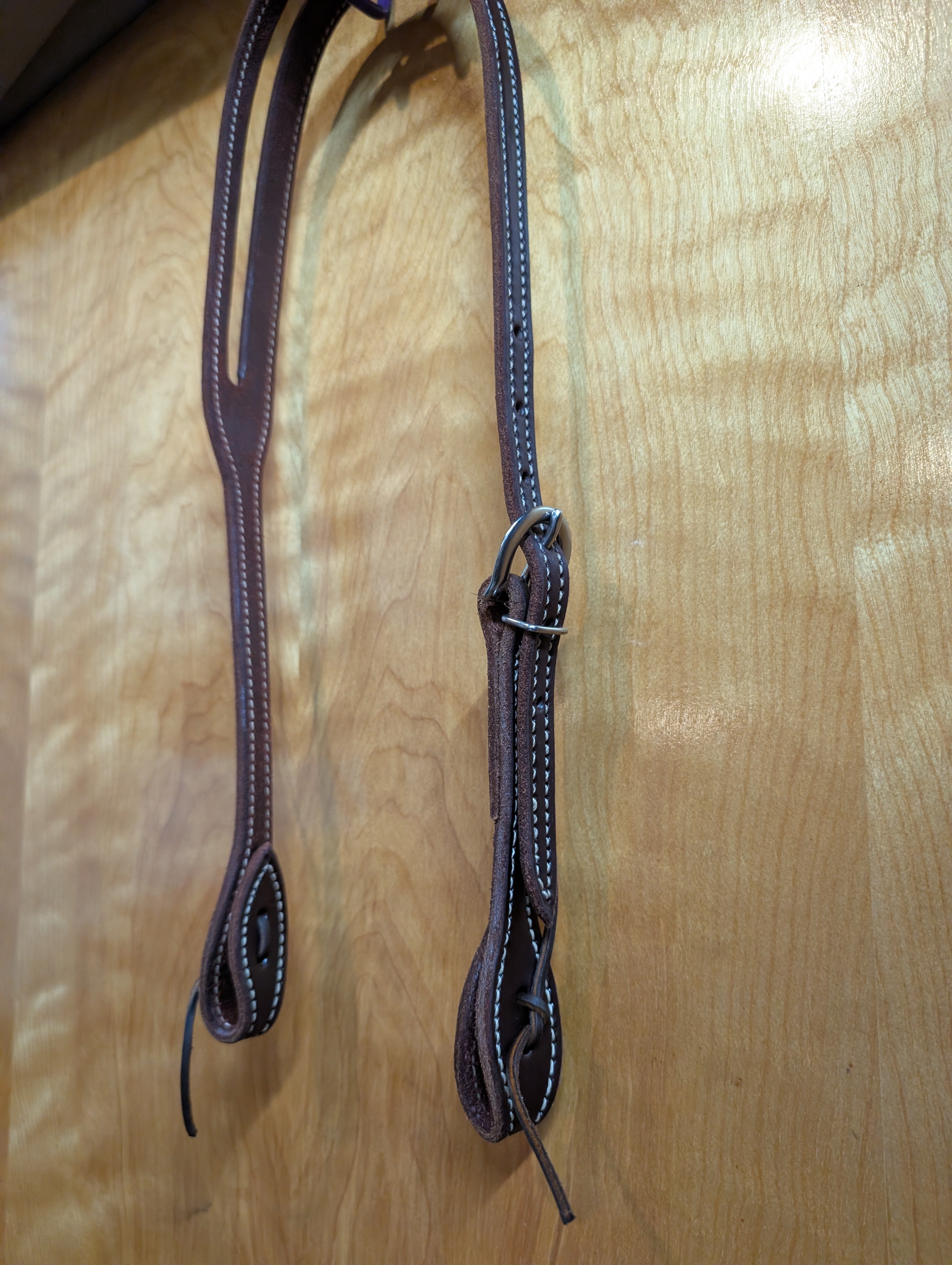 Harness leather oiled split ear headstall. 