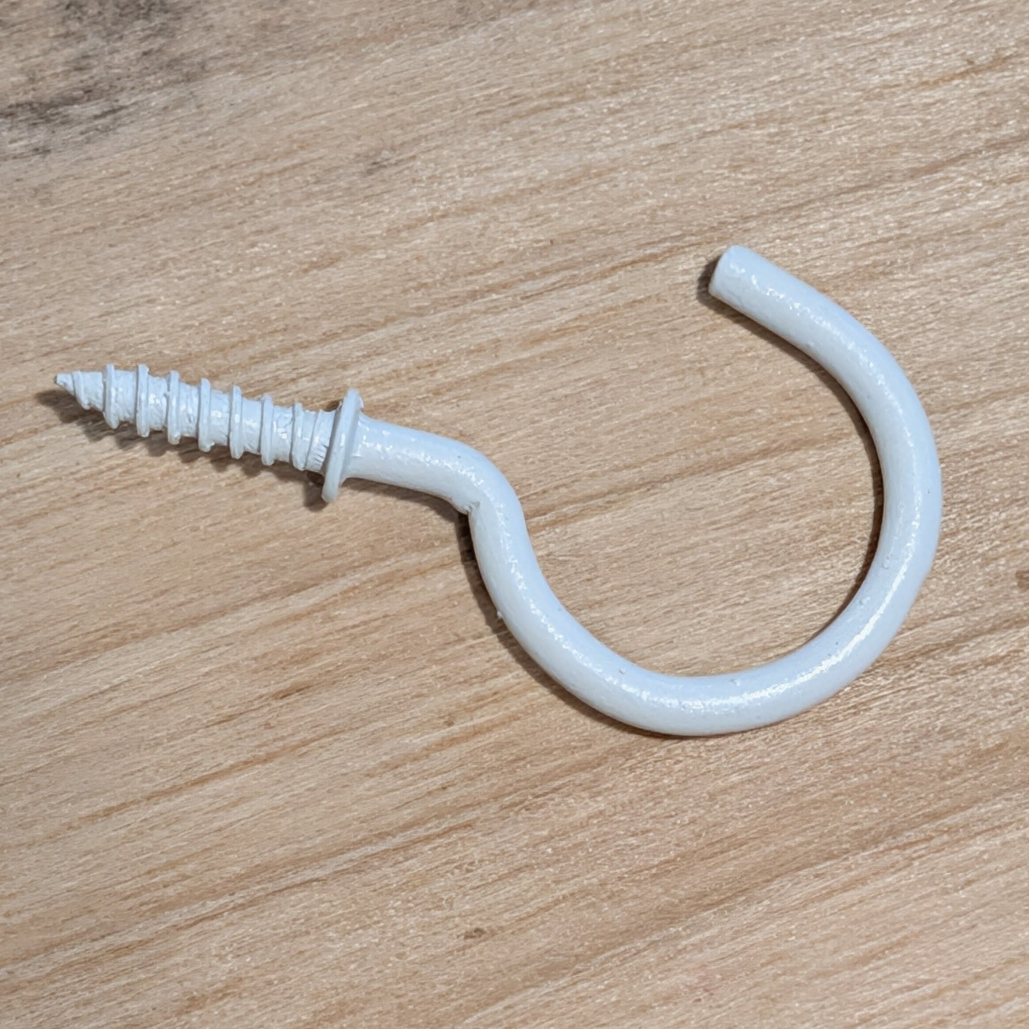 White metal screw in cup hook part of a 30 pack
