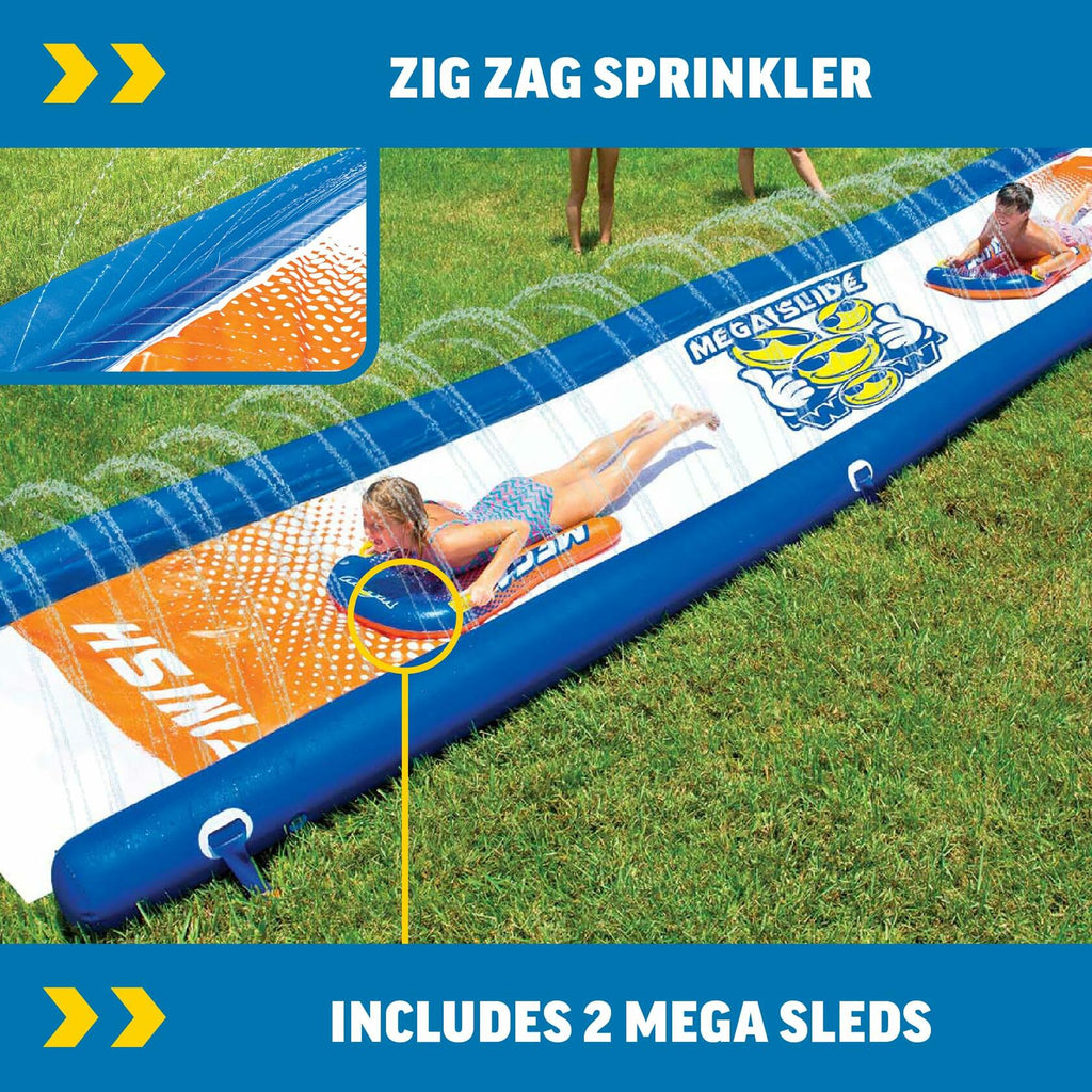 Inflatable water slide with zigzag sprinkler on grass