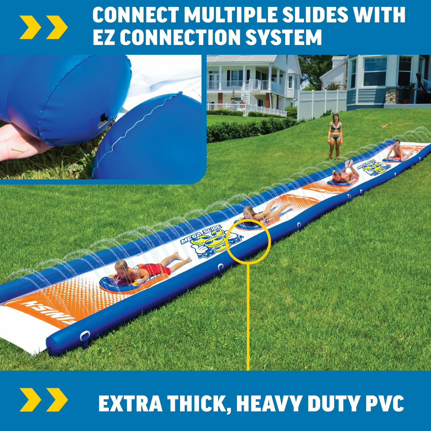 Inflatable water slide with people using it on grass.