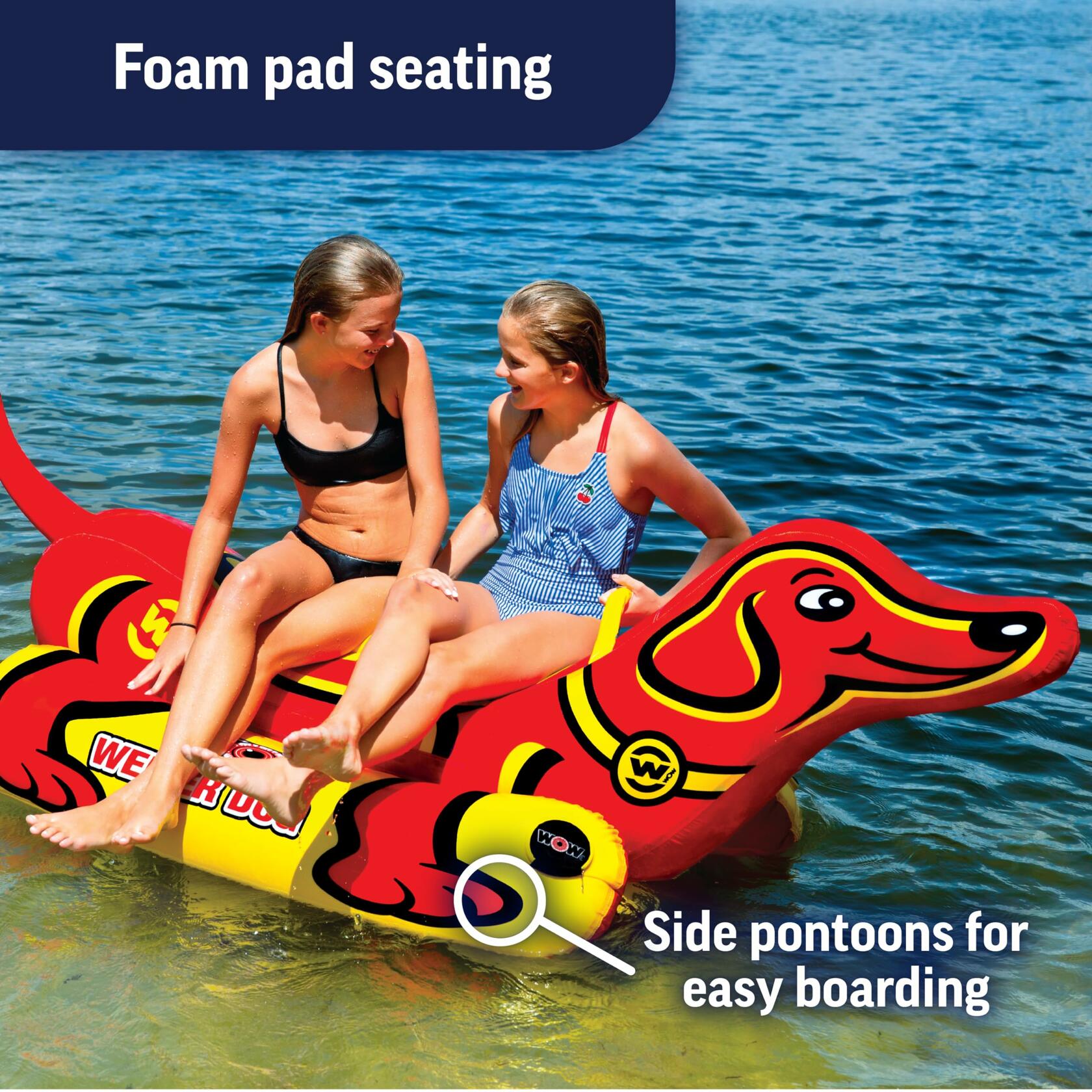 Two people on a red dog-shaped inflatable raft in water 