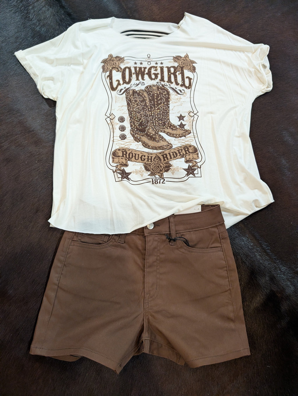 Ivory knit top with western boot graphic and boat neckline