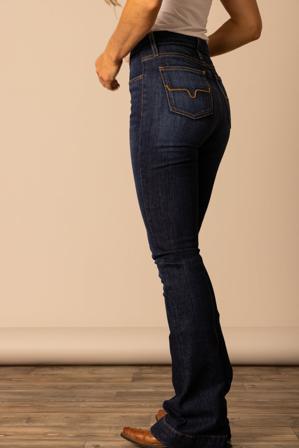 The Jennifer makes a vintage western statement in the saddle or on the city streets with a dark wash and hand-sanding whisker details. 