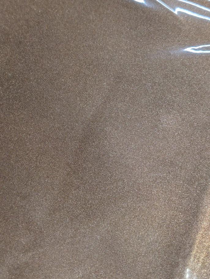 Close up a Lite brown wild rag/ scarf