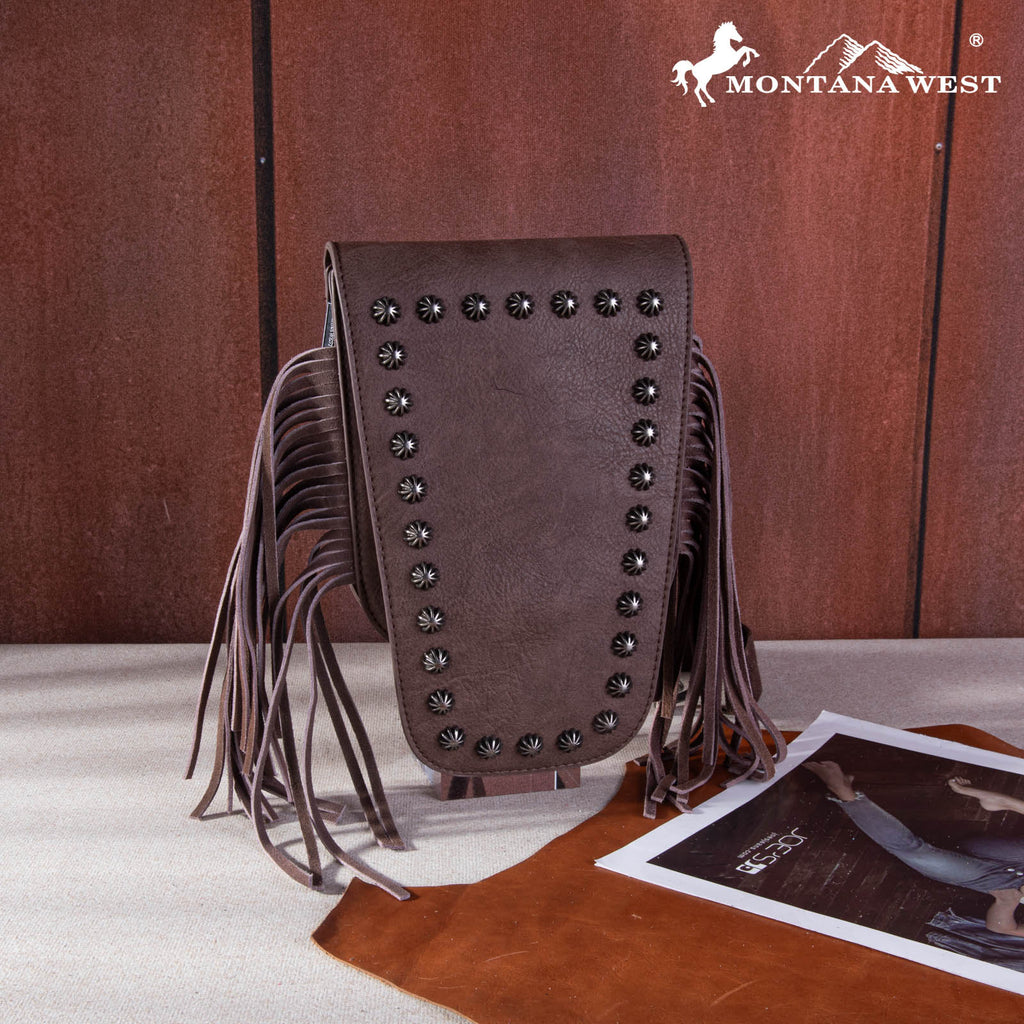 Brown leather bag with fringe and studs on a wooden surface, featuring the Montana West logo.