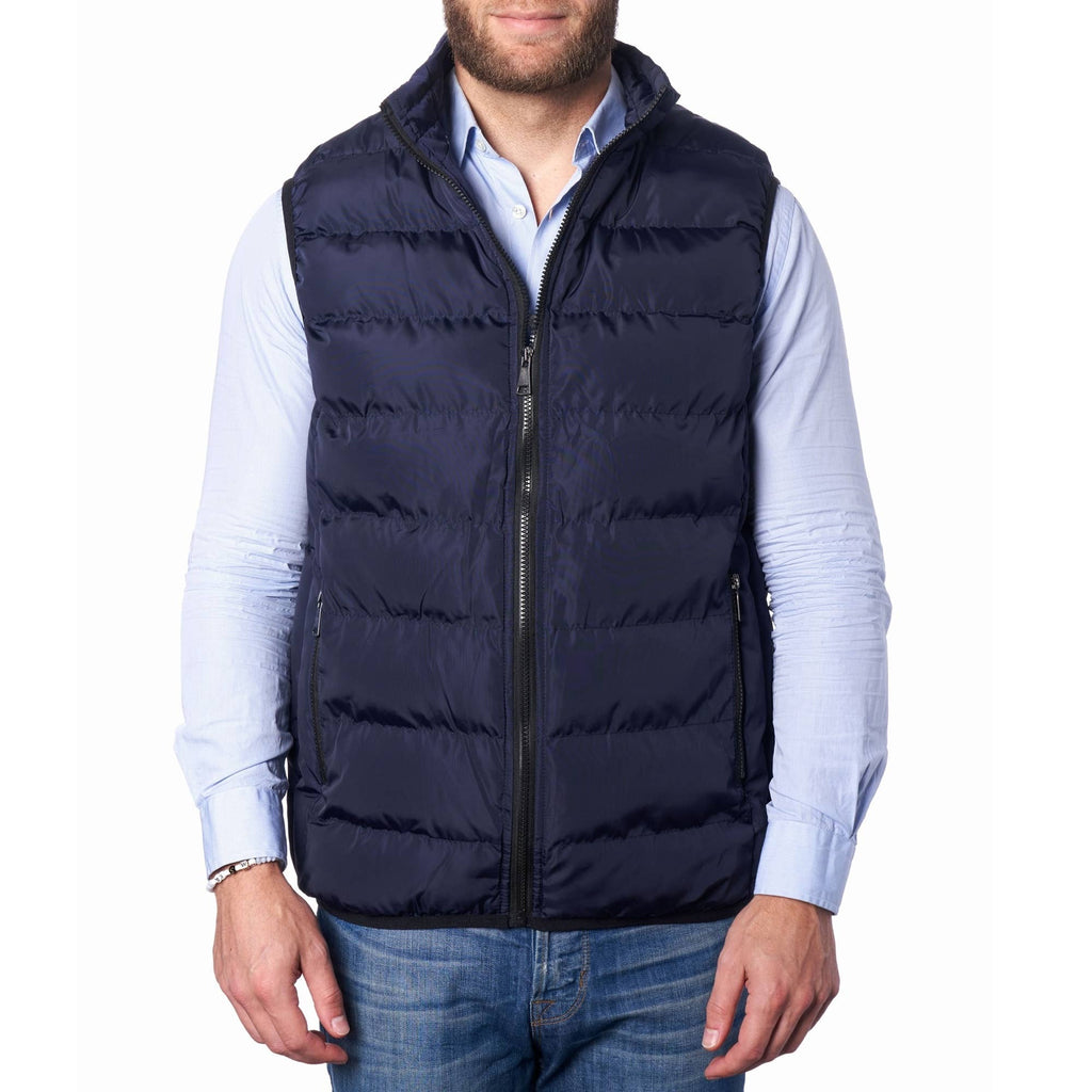 A man wearing a navy blue lightweight down alternative puffer vest with a collar, zippered front, and sleeveless design.