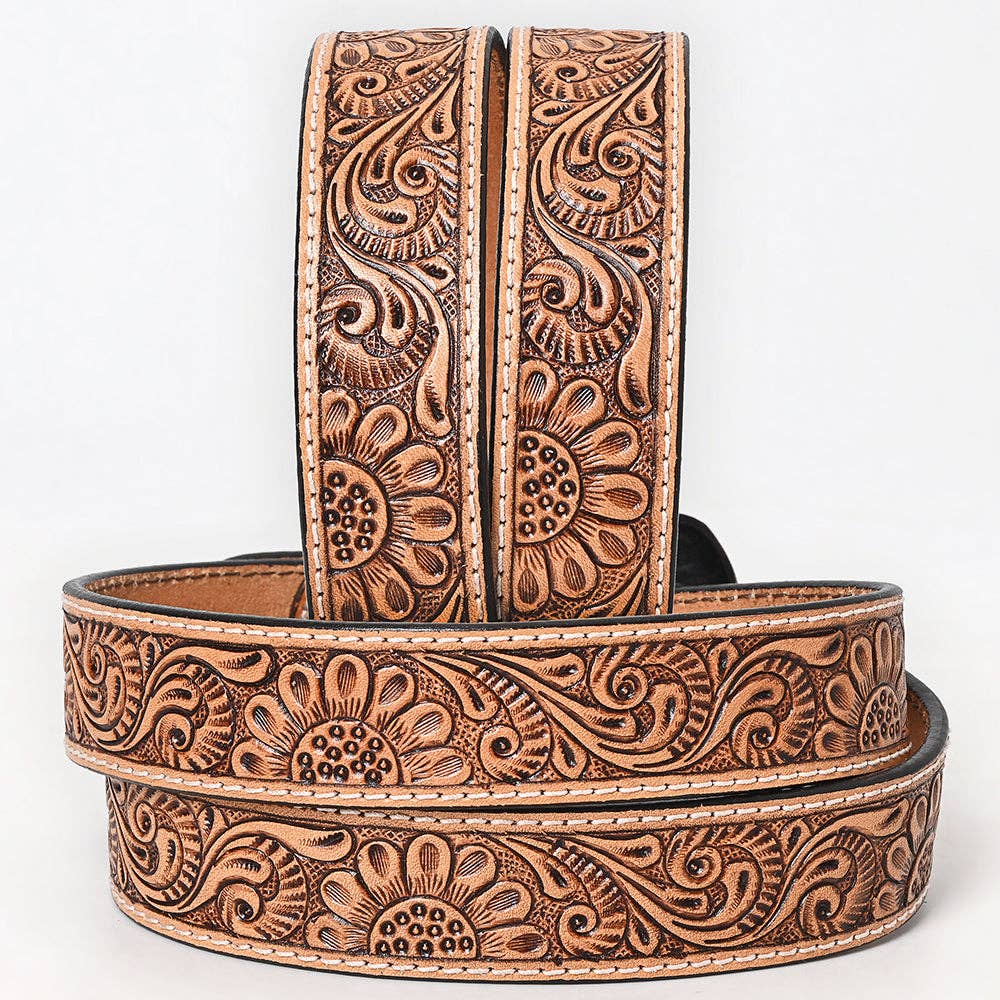Brown leather belt with intricate floral patterns on a white background