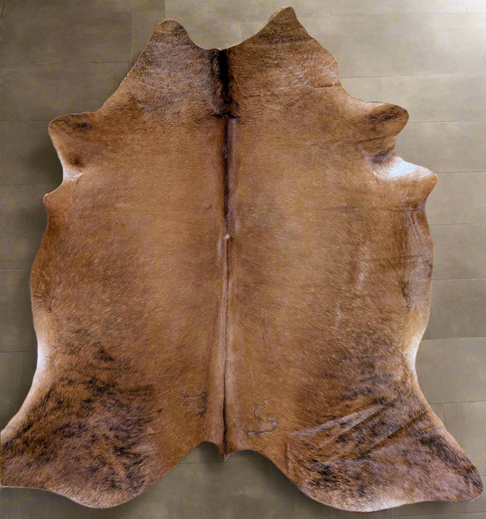 Red brindle cowhide rug