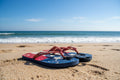 Red, white, and blue flip-flops with 'San Diego' branding on a textured surface.