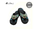 Black sandals with decorative straps featuring beads on a white background, branded as Montana West.