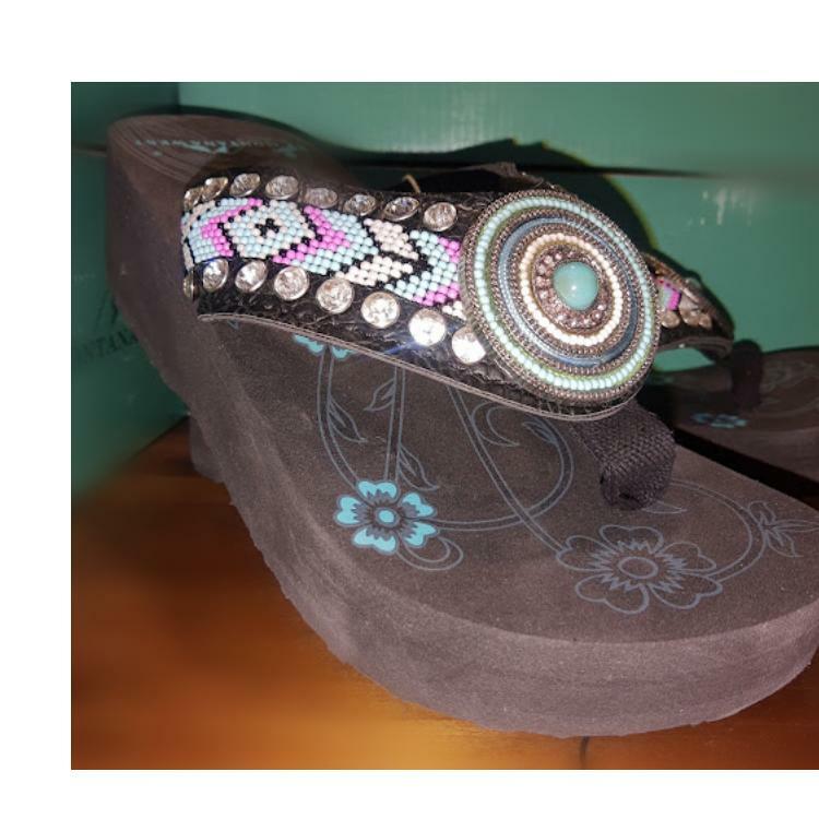 Close-up of turquoise gem beaded concho and floral logo on wedge sandal sole, no returns