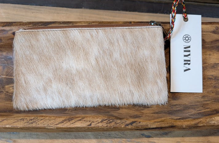 WILDFIRE LEATHER AND HAIRON WALLET on a wood surface