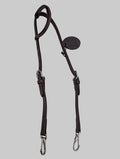 Brown leather bridle on a light gray background