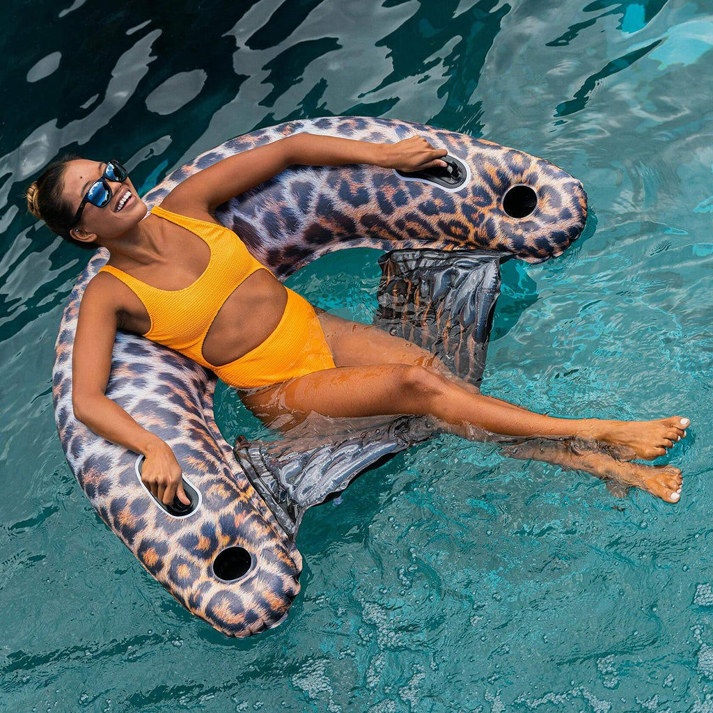 "Oversized safari-style float lounger ideal for poolside relaxation and tanning.