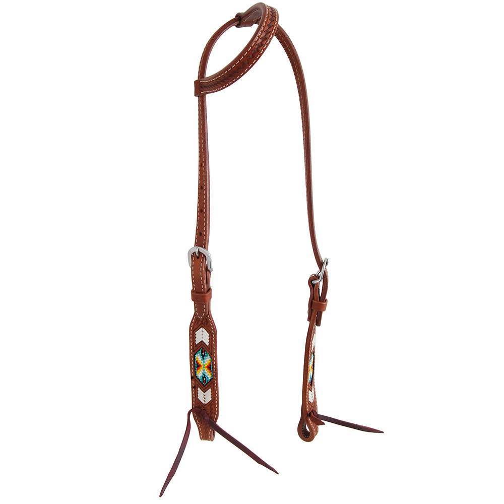 Brown leather horse bridle with decorative elements on a white background