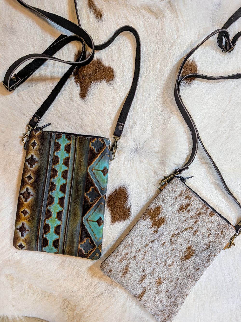 Two styles of genuine leather crossbody bags featuring western tooling and smooth rustic design, shown side by side.