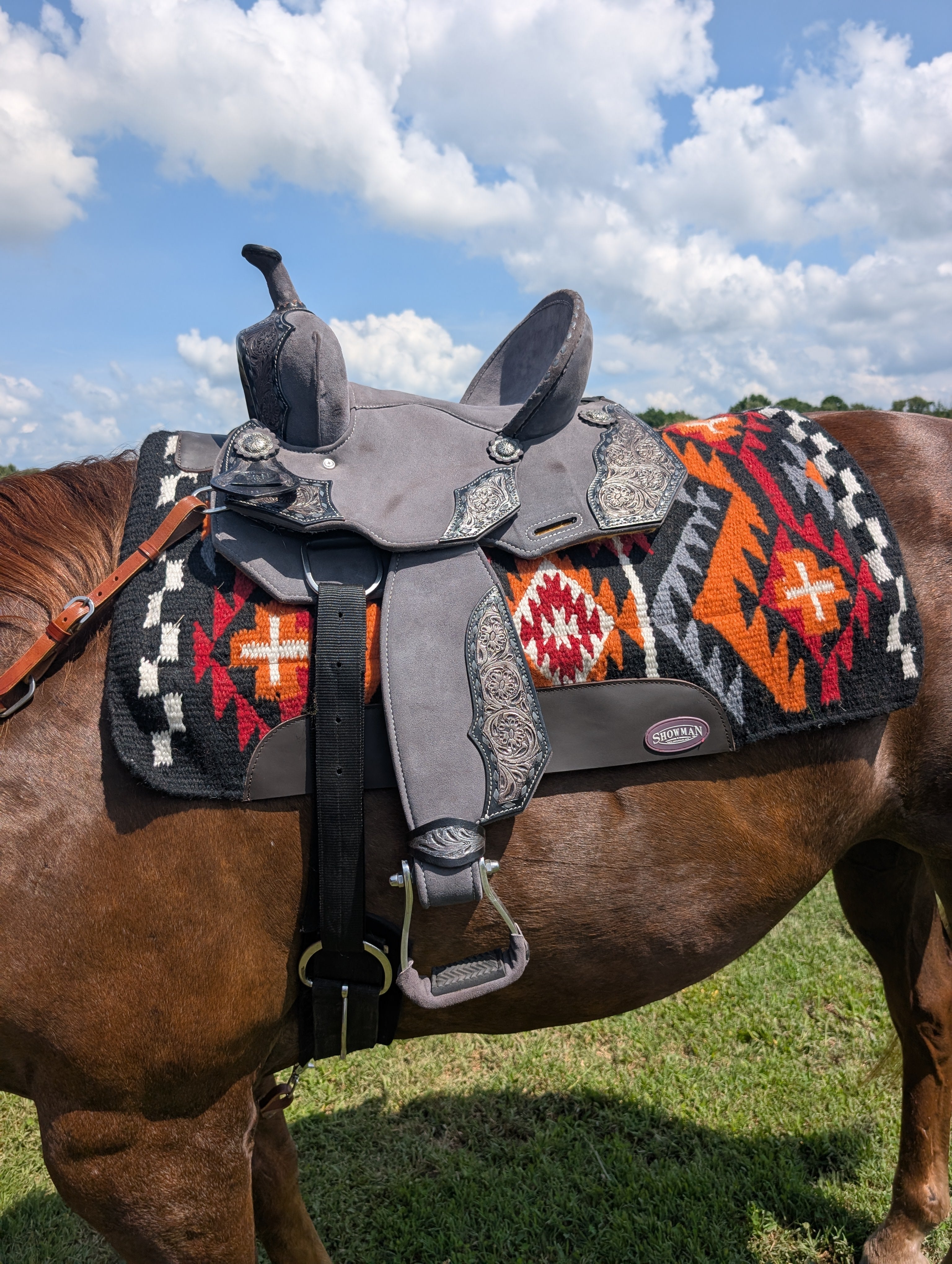 12-inch Royal King Youth Laramie Saddle in black suede with tooled leather overlay and aluminum stirrups.