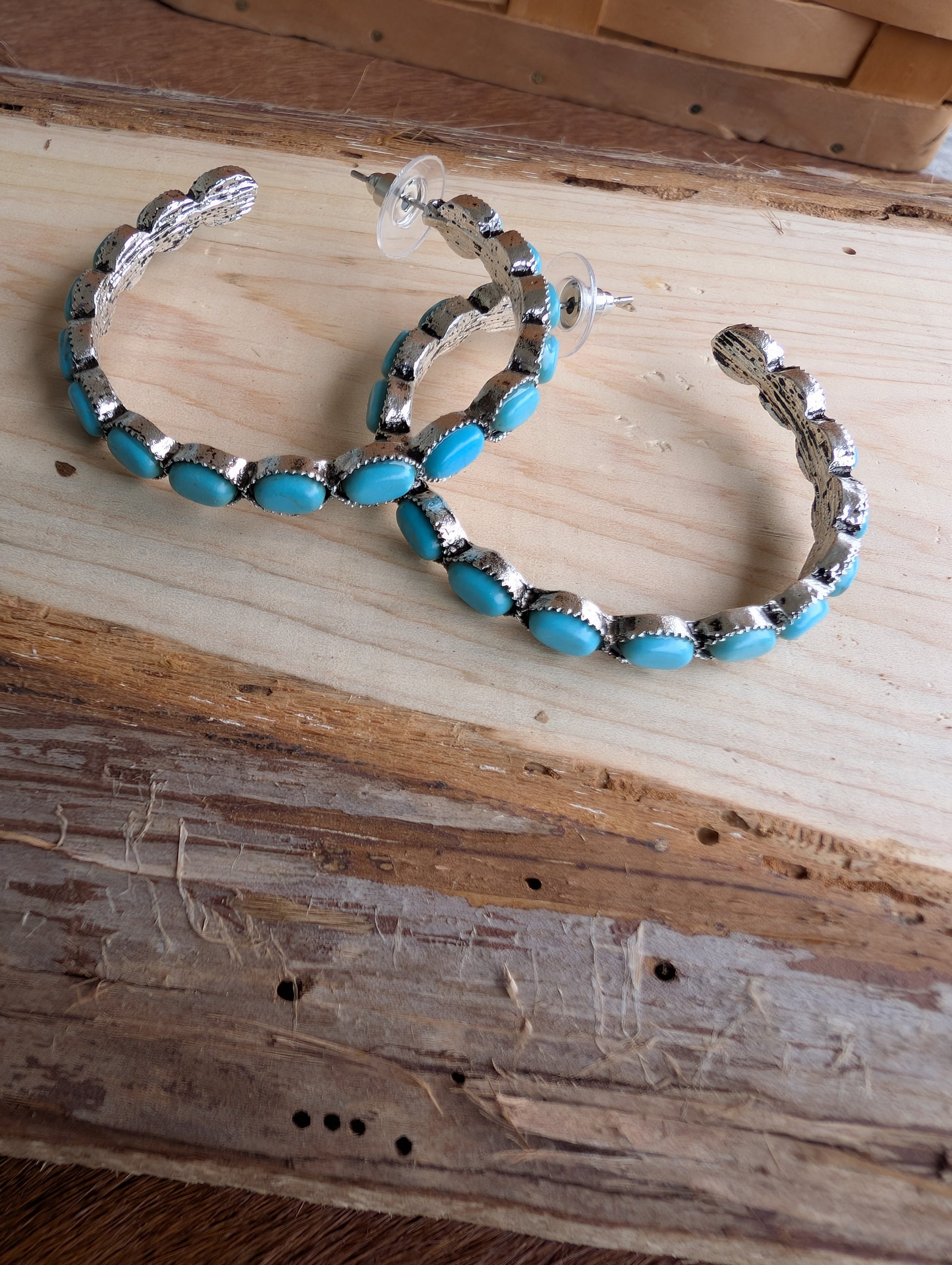 Women's turquoise hoop earrings styled for rodeo and festivals
