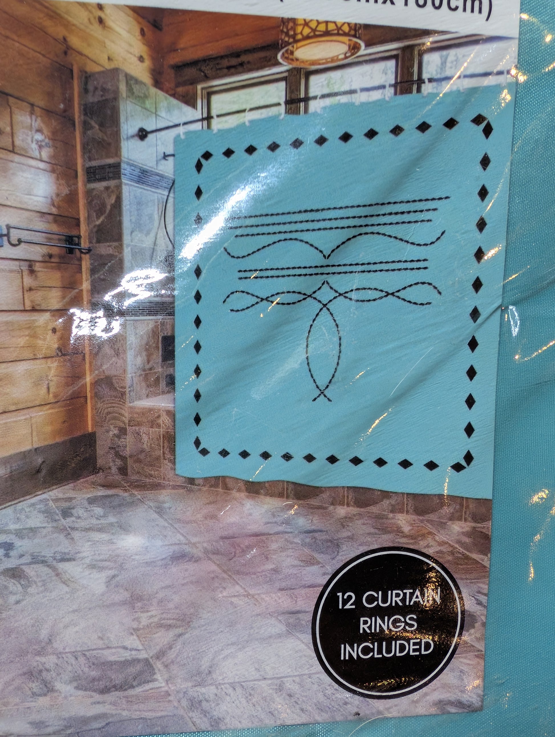 Rustic western bathroom shower curtain with bold geometric patterns and included hanging rings.