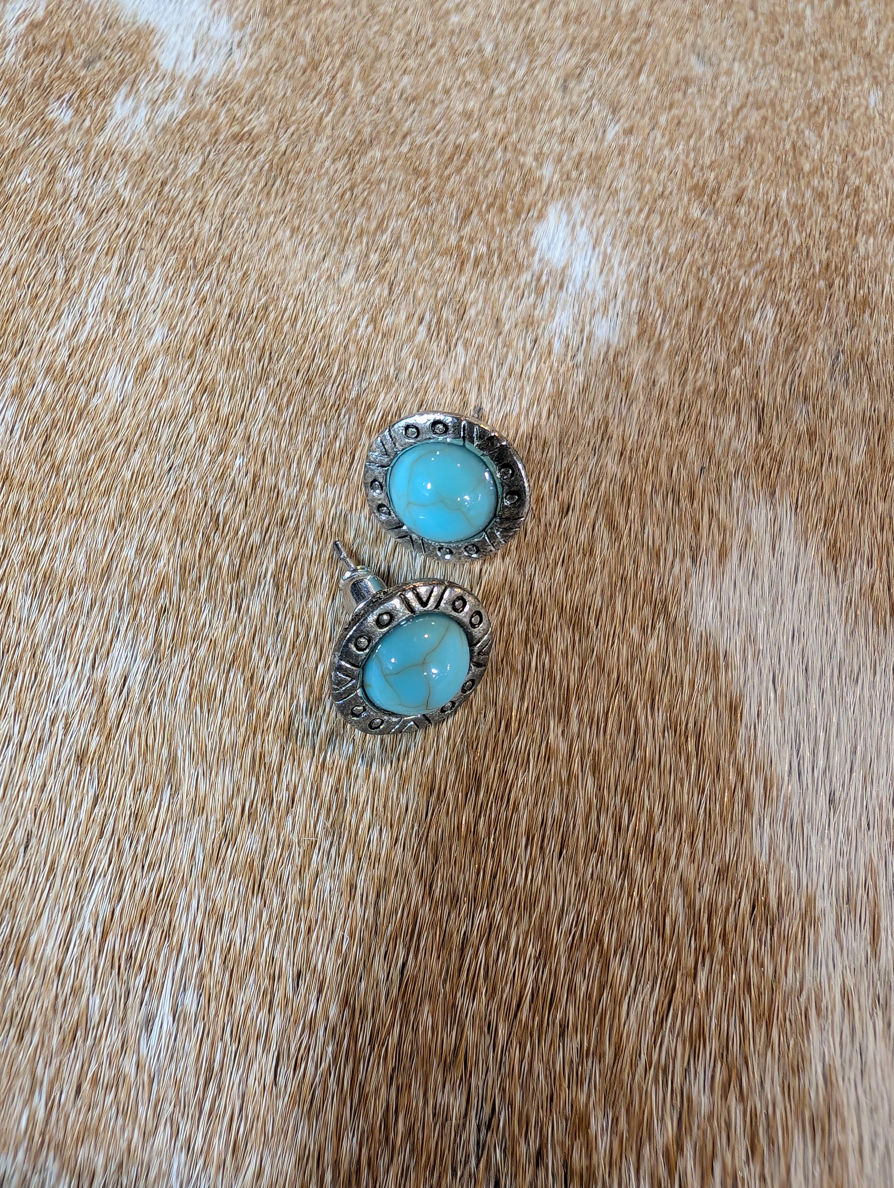 Western Spirit turquoise stud earrings featuring vintage inlaid stones in silver-tone setting displayed on rustic background