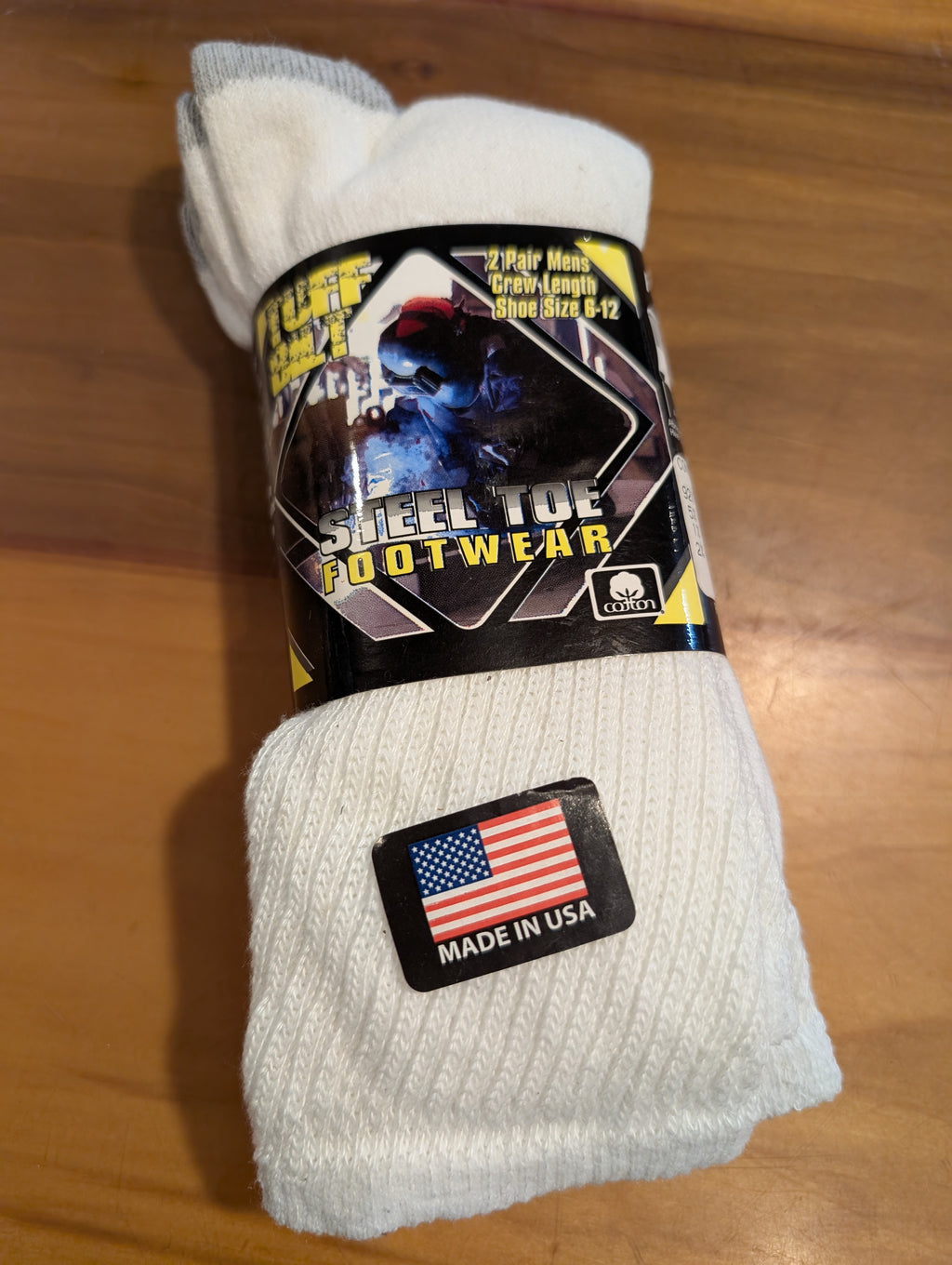 White sock with label on a wooden surface