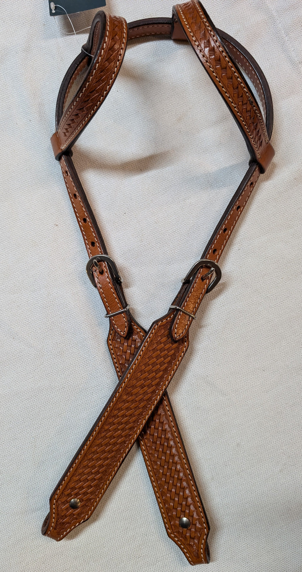 Brown leather bridle on a white background