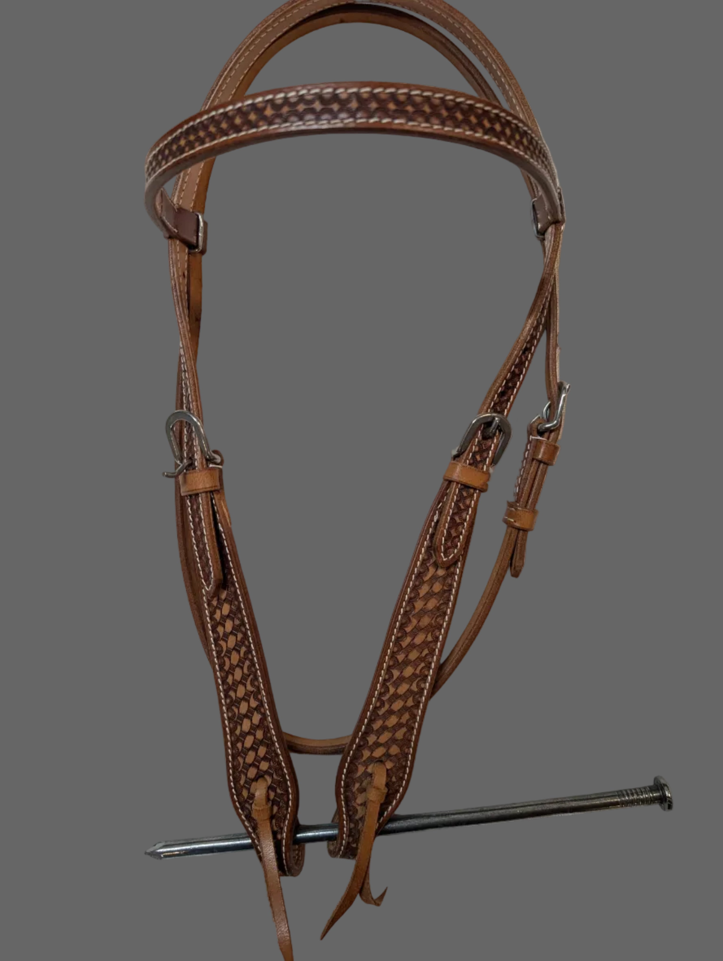 Brown leather bridle on a white background