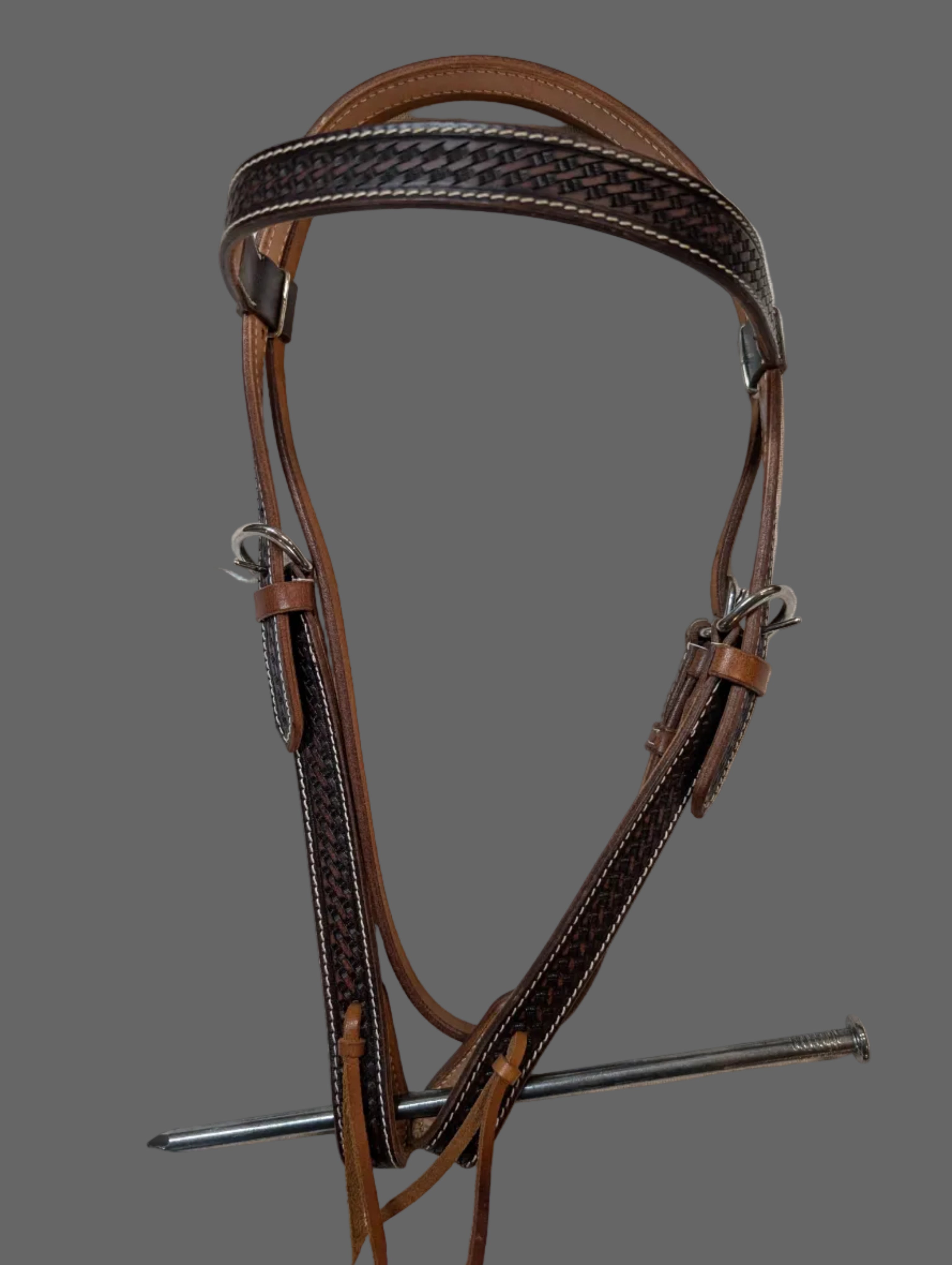 Brown leather bridle on a white background