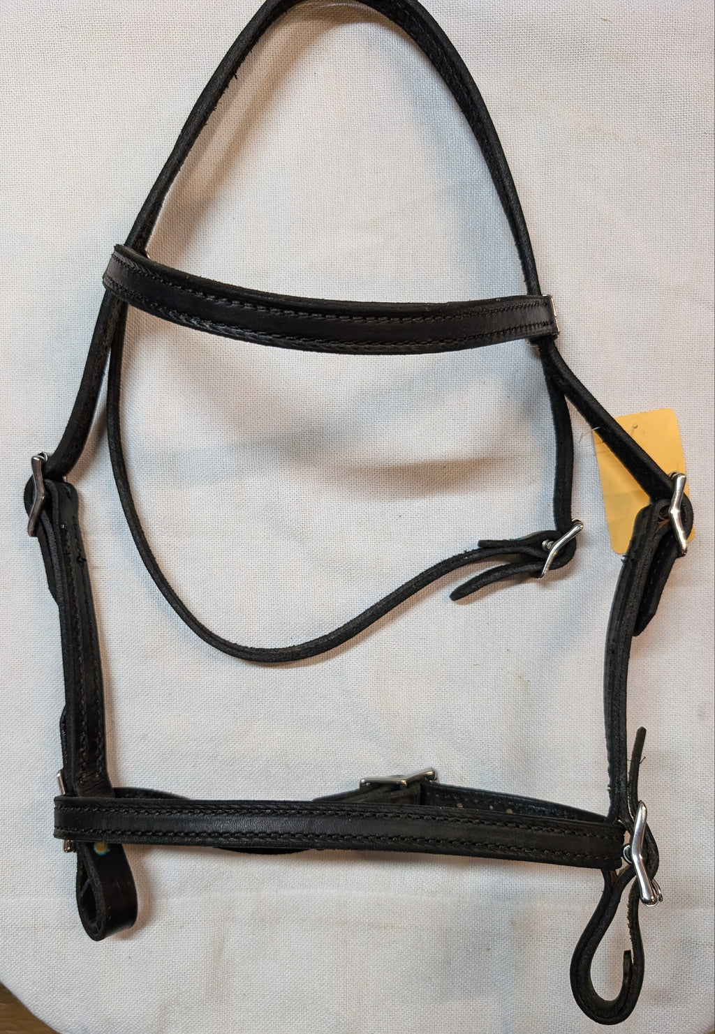 Black leather bridle on a white background