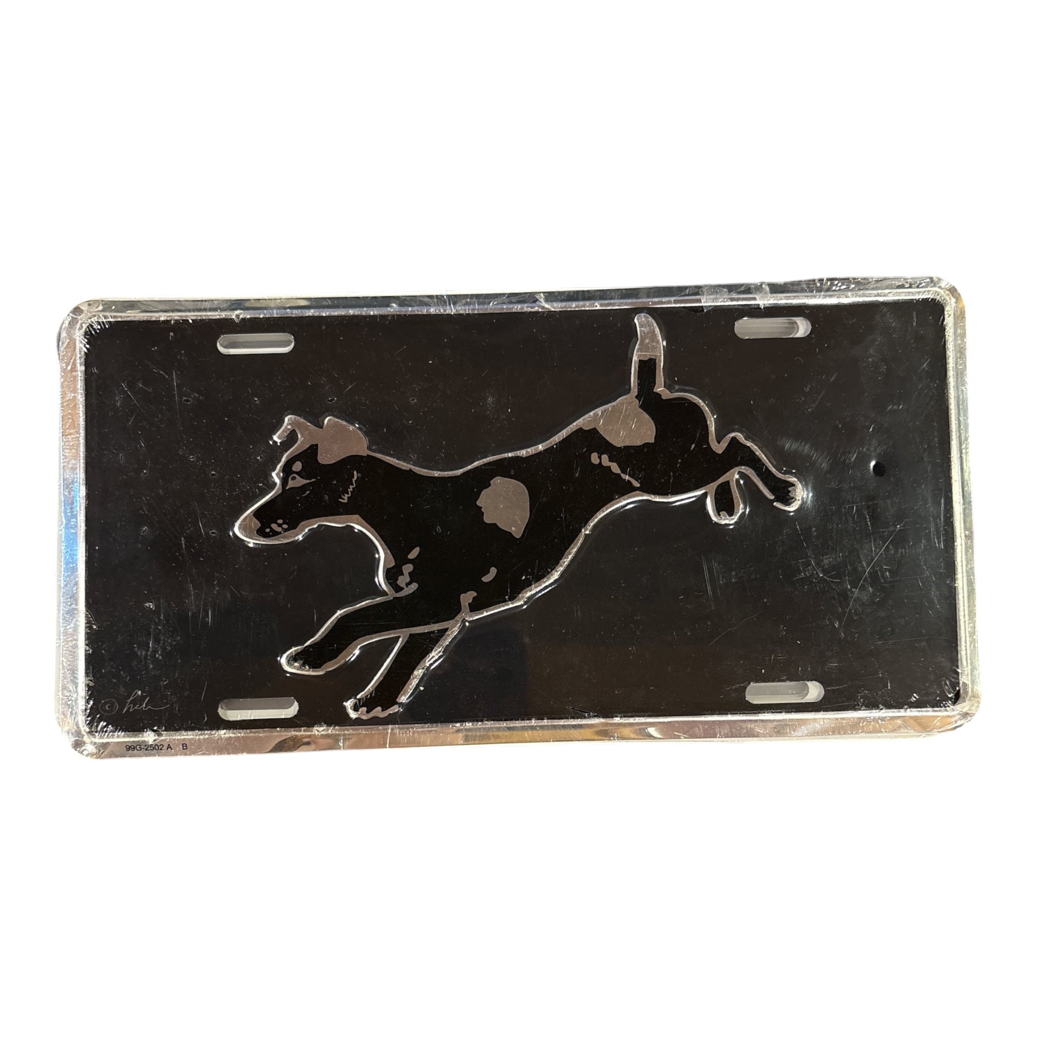 A rectangular black license plate featuring a raised silver silhouette of a leaping dog, shown against a plain white background.