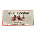 A novelty license plate featuring the text 'TEAM PENNING' and 'AMERICA'S EQUINE SPORT' with a black illustration of a horse gate scene, on a white background with a red border.